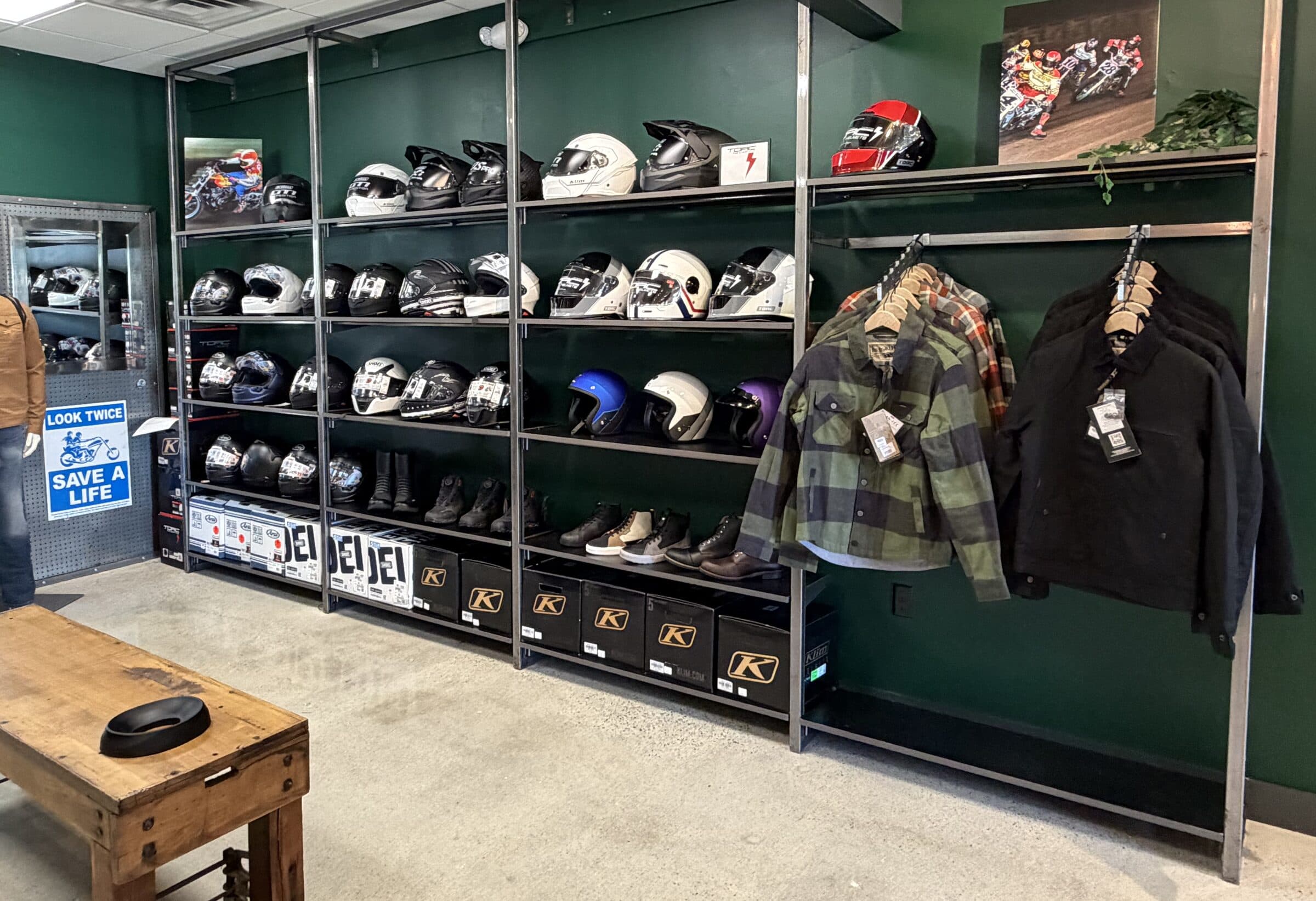 Helmets, boots and jackets on the shelves at SIDEROAD63 in North Hampton, New Hampshire